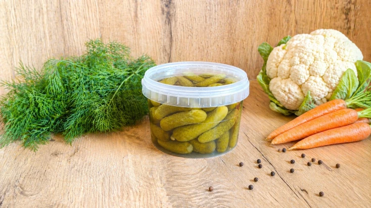 Hungarian mini cucumbers pickled in vinegar, a crunchy side dish for sandwiches, appetizers, and everyday meals.