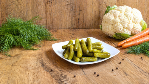 Hungarian mini cucumbers pickled in vinegar, a crunchy side dish for sandwiches, appetizers, and everyday meals.
