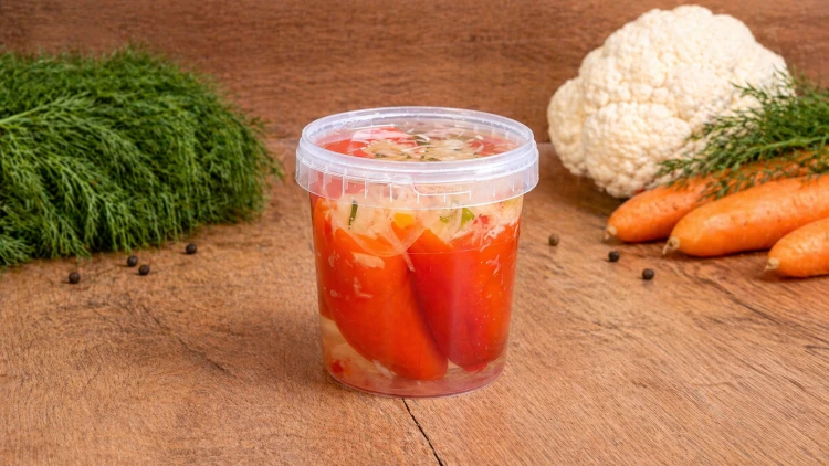 Hungarian Kapia pepper stuffed with pickled vegetable salad and preserved in vinegar.