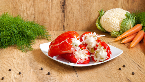 Hungarian Kapia pepper stuffed with pickled vegetable salad and preserved in vinegar.