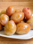 Hungarian plums pickled in vinegar, a sweet and tangy side dish for meats, cheeses, and appetizers.