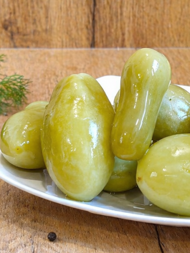 Hungarian green tomatoes pickled in vinegar, perfect for salads and party appetizer platters.