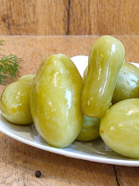 Hungarian green tomatoes pickled in vinegar, perfect for salads and party appetizer platters.