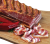 Dry-aged, smoked and air-dried pork belly presented on a wooden board, showcasing rich marbling, sliced cured meat, and a natural smoky finish inspired by traditional Hungarian charcuterie.