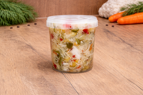 Mild Hungarian pickled vegetable salad (Csalamádé csemege) in a plastic bucket.