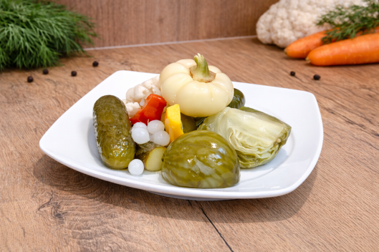Mild Hungarian pickled vegetable mix Darabos Savanyúság served on a plate.