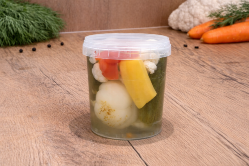 Mild Hungarian pickled vegetable mix Darabos Savanyúság in a plastic bucket.