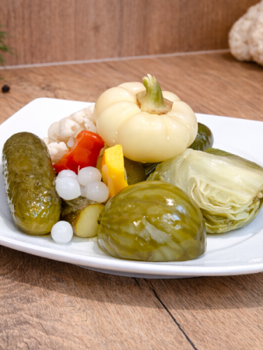 Mild Hungarian pickled vegetable mix Darabos Savanyúság served on a plate.