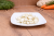Pickled garlic from Vecsés served on a plate as a traditional Hungarian pickle.
