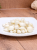 Pickled garlic from Vecsés served on a plate as a traditional Hungarian pickle.