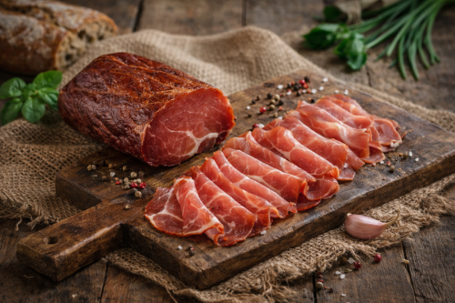 Hungarian dry-cured, smoked pork tenderloin is delicate charcuterie sliced paper-thin prosciutto-style. Clean, savory aroma and firm texture—perfect for rustic boards, premium sandwiches, and elegant tasting plates.
