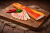 Thin-sliced smoked Hungarian bacon (szalonna) with a rich, savory aroma and delicate cured texture. Paper-thin slices served on a wooden board in a rustic, elegant setup—perfect for charcuterie boards and tasting plates.