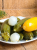 Hungarian mini zucchini pickled in vinegar with onion, mustard, coriander, and spices.